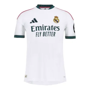 Real Madrid 26/27 Home Player Version football jersey in white with dark green collar and sleeve details, pink adidas shoulder stripes, and premium slim-fit design displayed on a plain background.